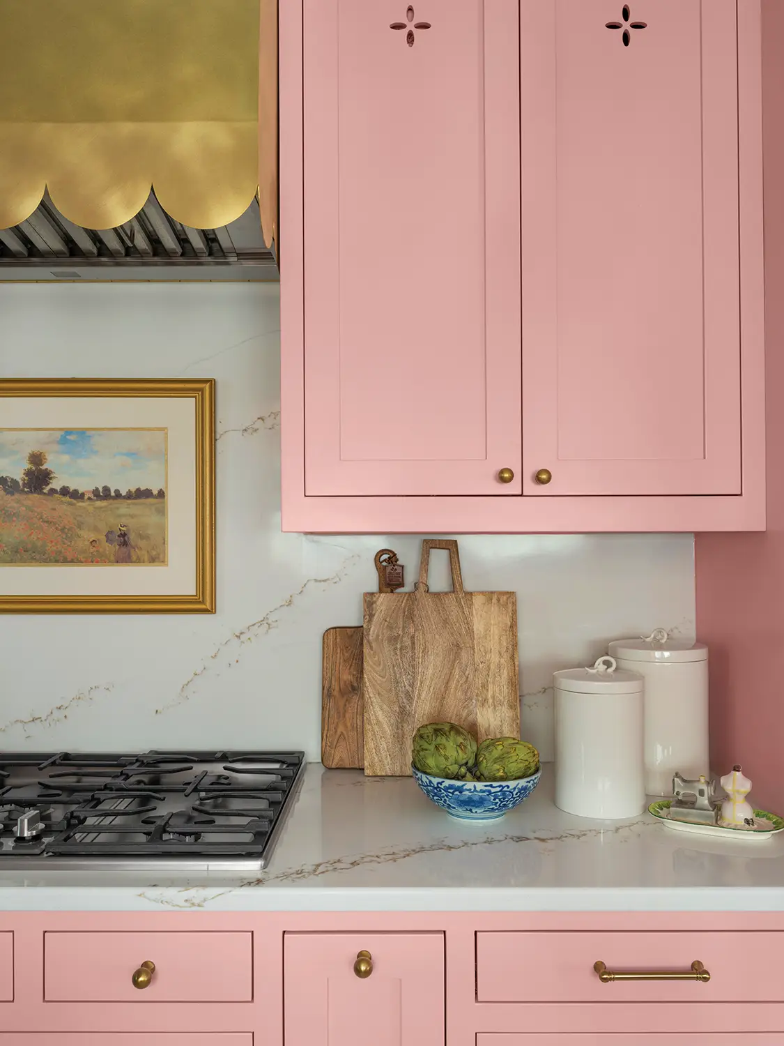 scalloped edges on bronze range hood in renovated 1930 Tudor home