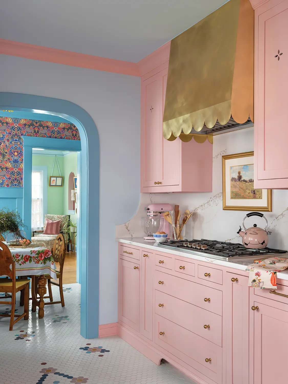 pink cabinetry, stand mixer and pig tea kettle in renovated Tudor home kitchen