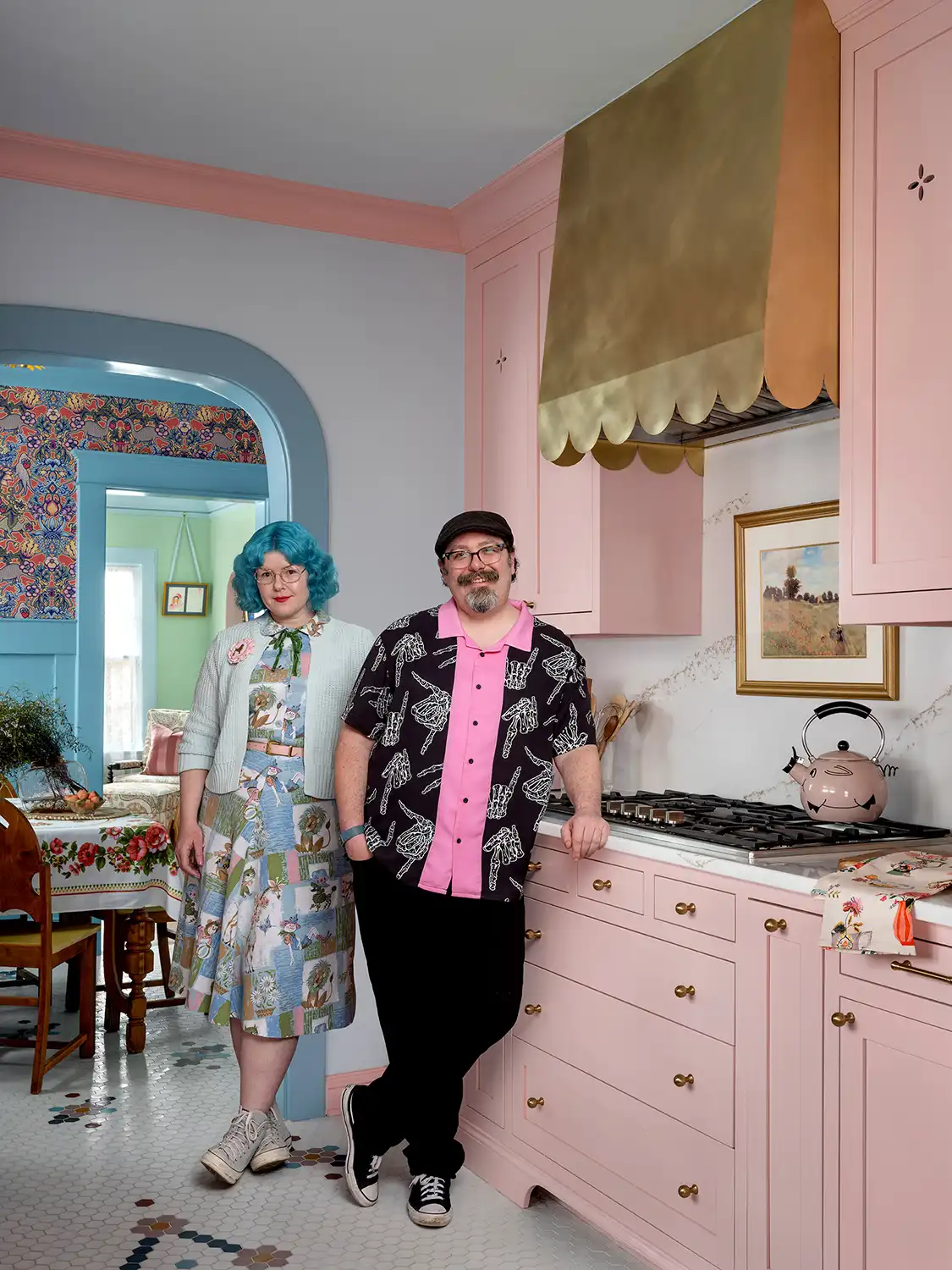 homeowners stand in their renovated 1930 Tudor home's kitchen