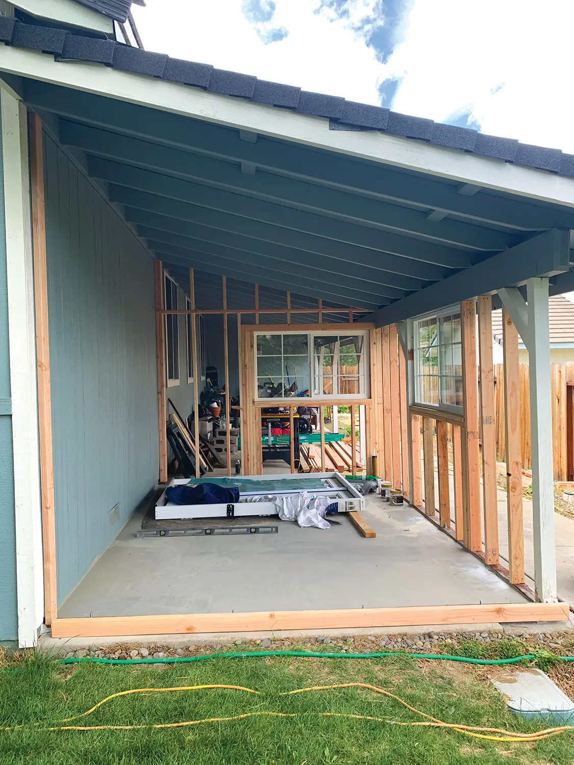 construction of hidden she shed under the eaves of the house